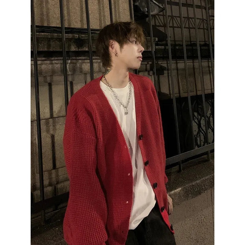 Men's loose-fit V-neck cotton-blend cardigan in army green, shown on a hanger.