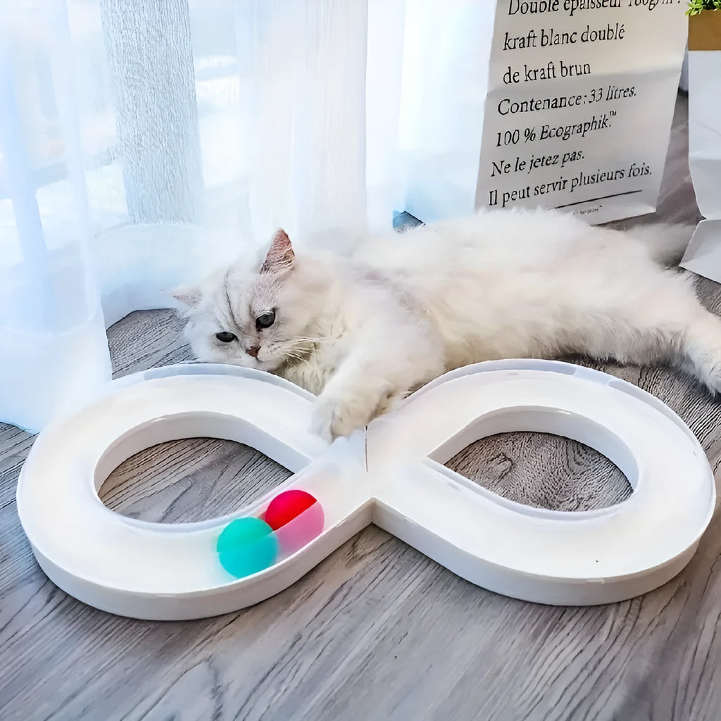 Blue and white interactive cat play station with turntable track, ball, and feather teaser stick.