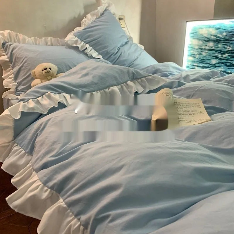 Solid colour washed linen quilt cover and pillowcases from a mori style four-piece bedding set.