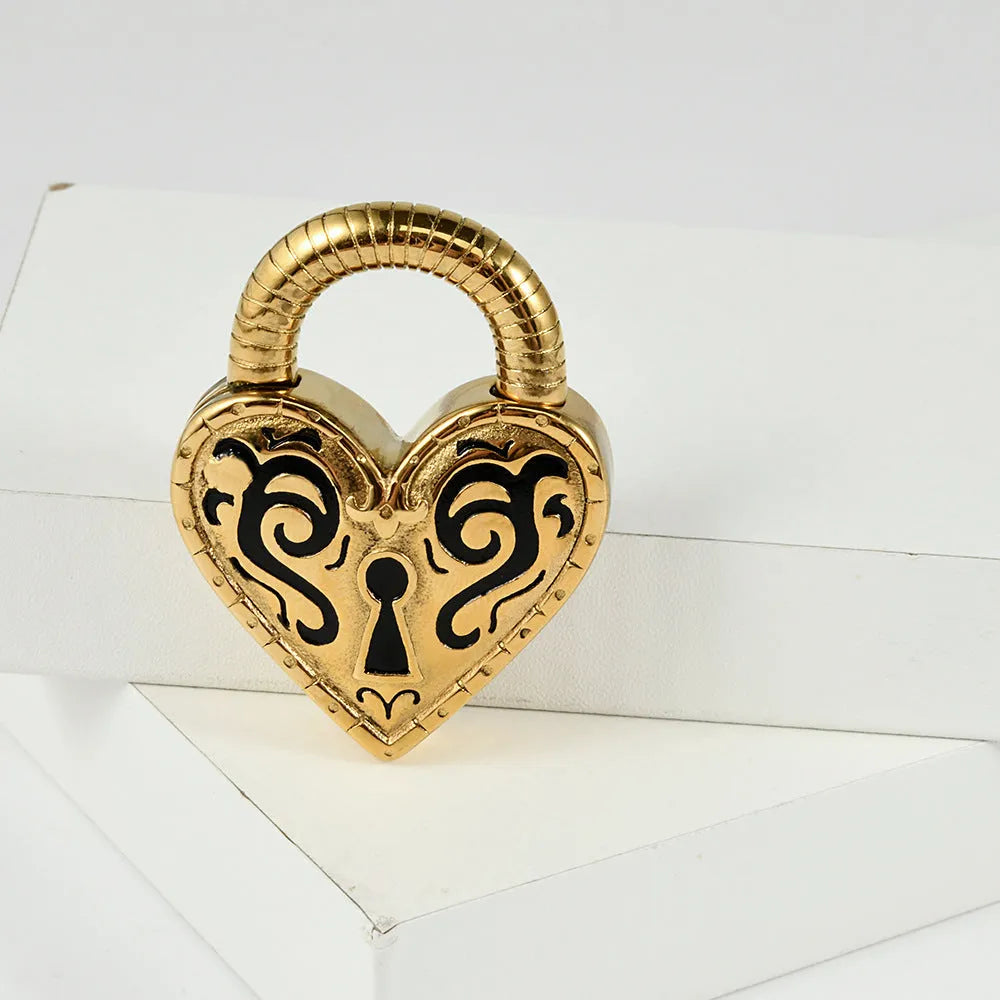 A pair of women's heart-shaped earrings in stainless steel with a gold electroplated finish.
