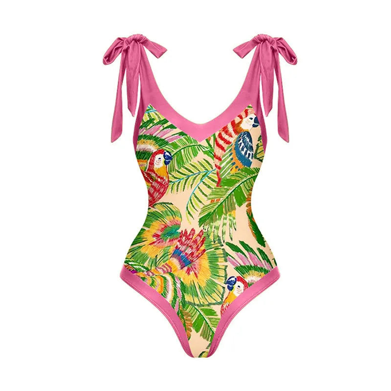 Women's pink floral print one-piece swimsuit with v-neck, covered belly, and attached thin skirt.