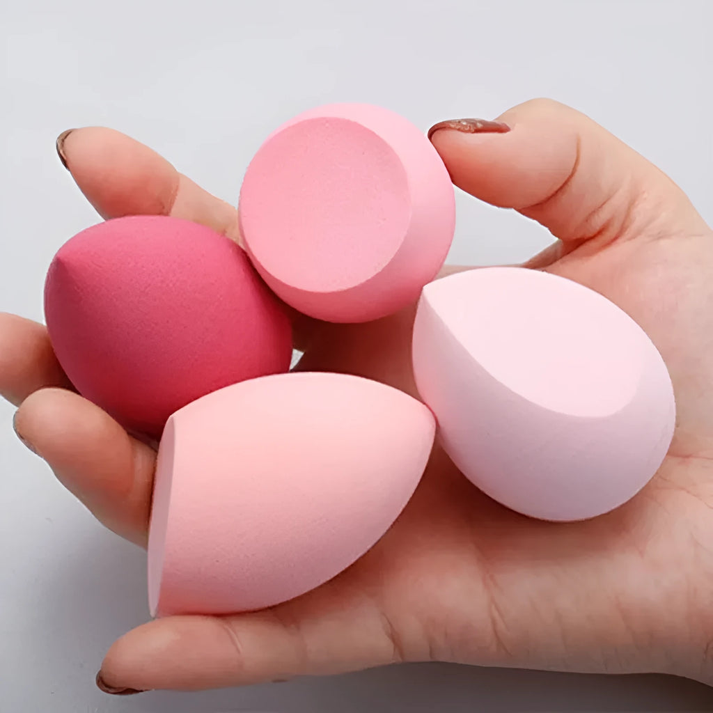 Assorted makeup sponges in seven shapes including pear and peach heart designs, 60x42mm, non-latex material
