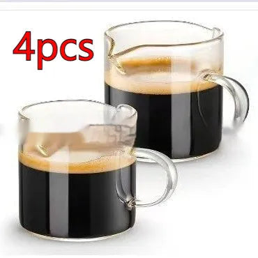 Two white transparent double mouth coffee glasses on a table.