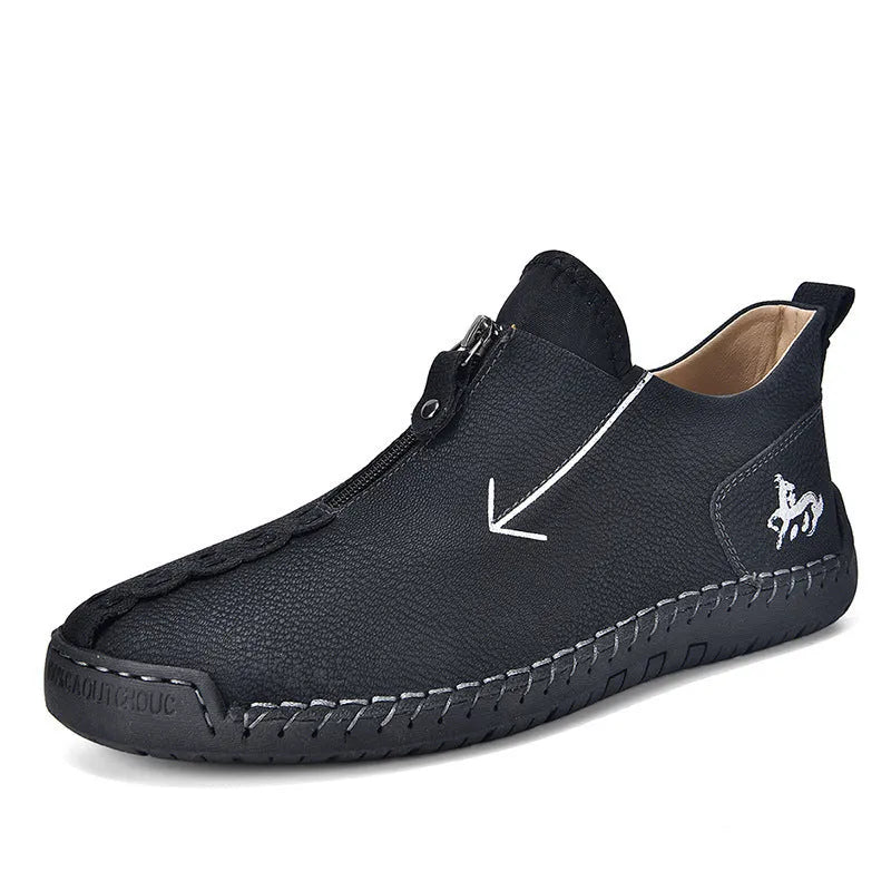 Men's black leather zip-up boots with round toe and hand-stitched rubber sole on a white background.