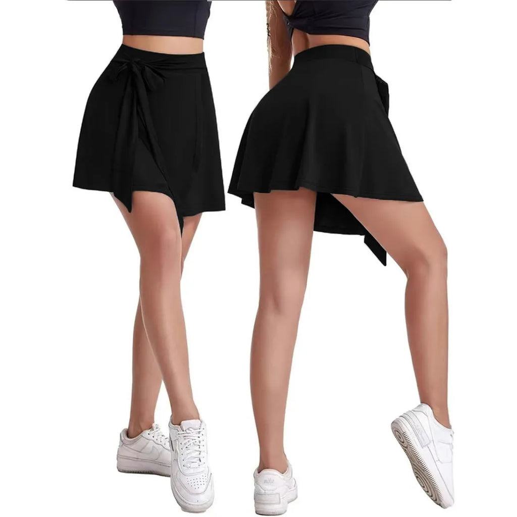 Black unisex high-waist sports skirt with built-in shorts and a shoulder strap detail.