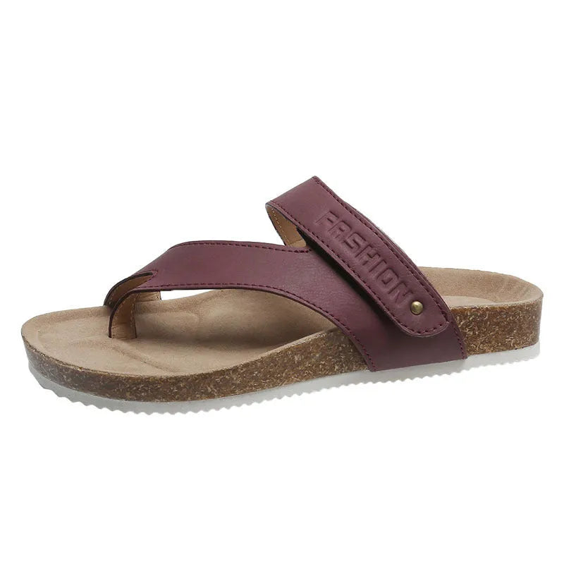Flat toe ring thick-soled flip-flop in a solid colour on a plain background