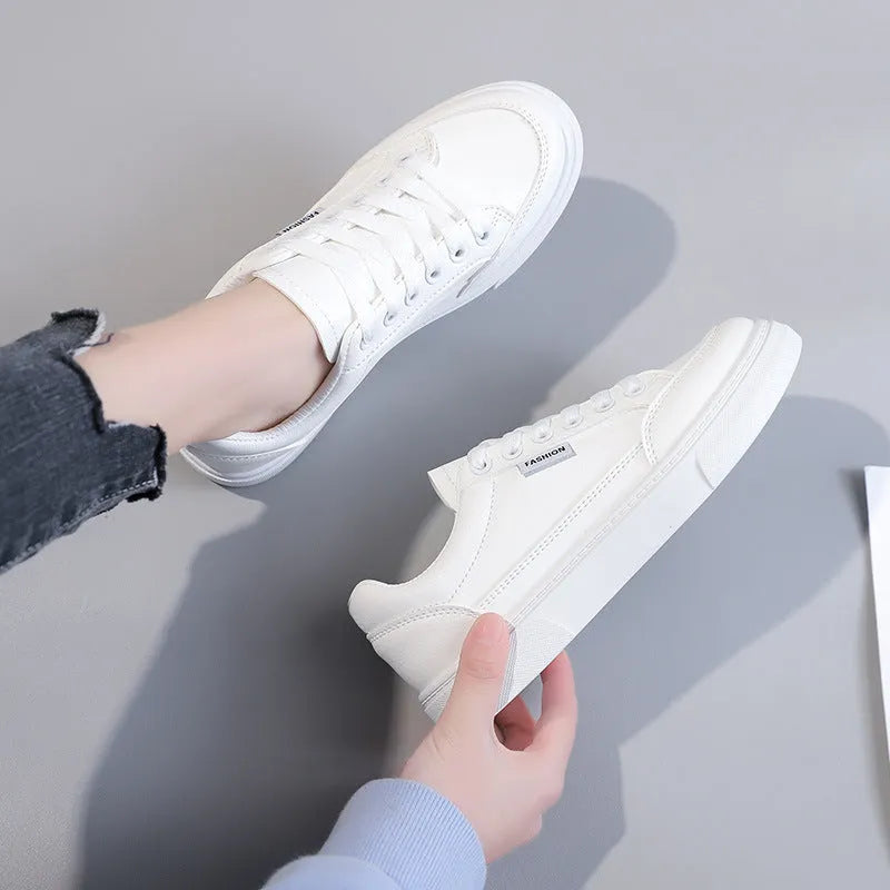 Women's low top sneakers in white or brown with artificial PU upper and plastic sole