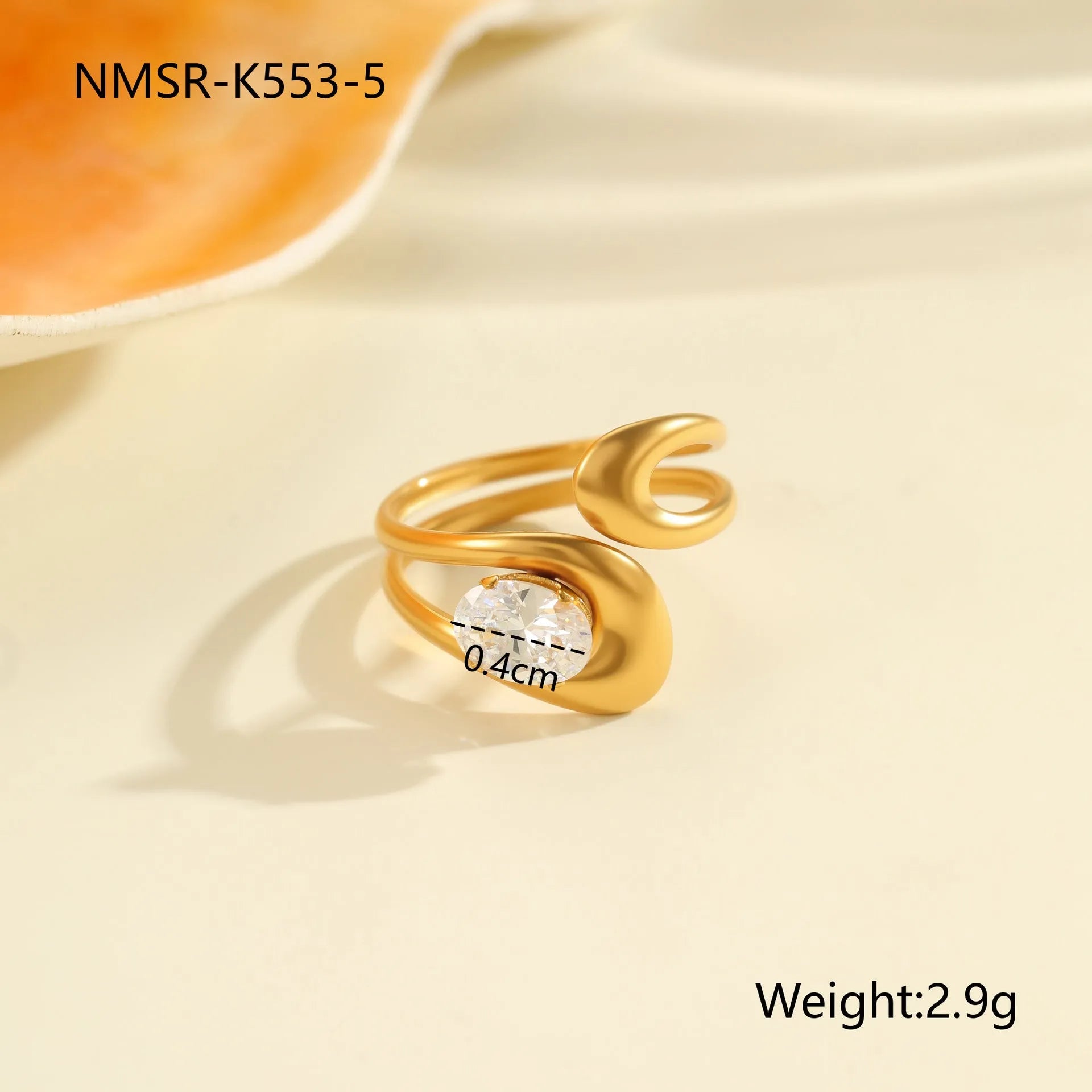 Geometric stainless steel zircon ring with open-mouth adjustable design on a hand.