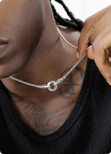 A sterling silver clavicle necklace for women with a minimalist pendant on a delicate chain.