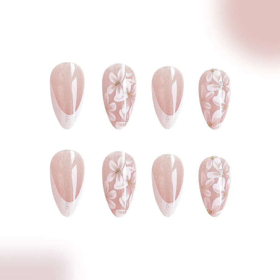 Short almond shaped artificial nails with French style and glittering powder flower design in C625 colour