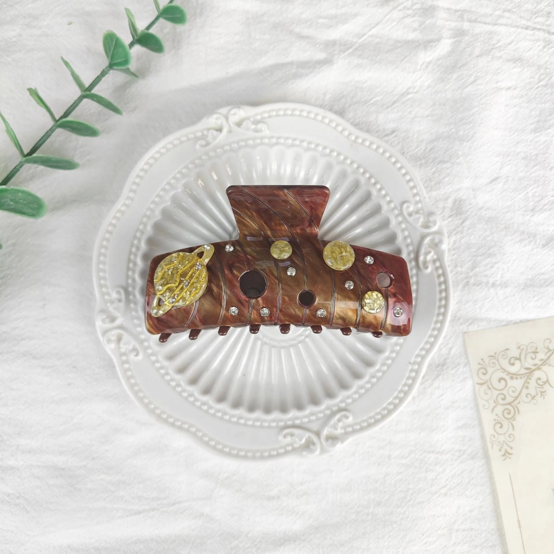 Oversized women's barrette with star moon starry sky pattern in sky blue colour.