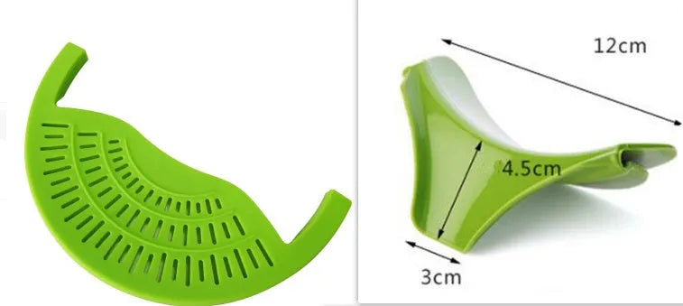 Black silicone food oil drainer snapped onto a pot rim, with liquid being poured off