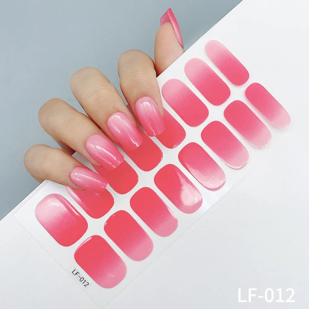 Set of 16 solid colour full nail art stickers showing patterns like cross, rose, tulip, and cartoon designs.
