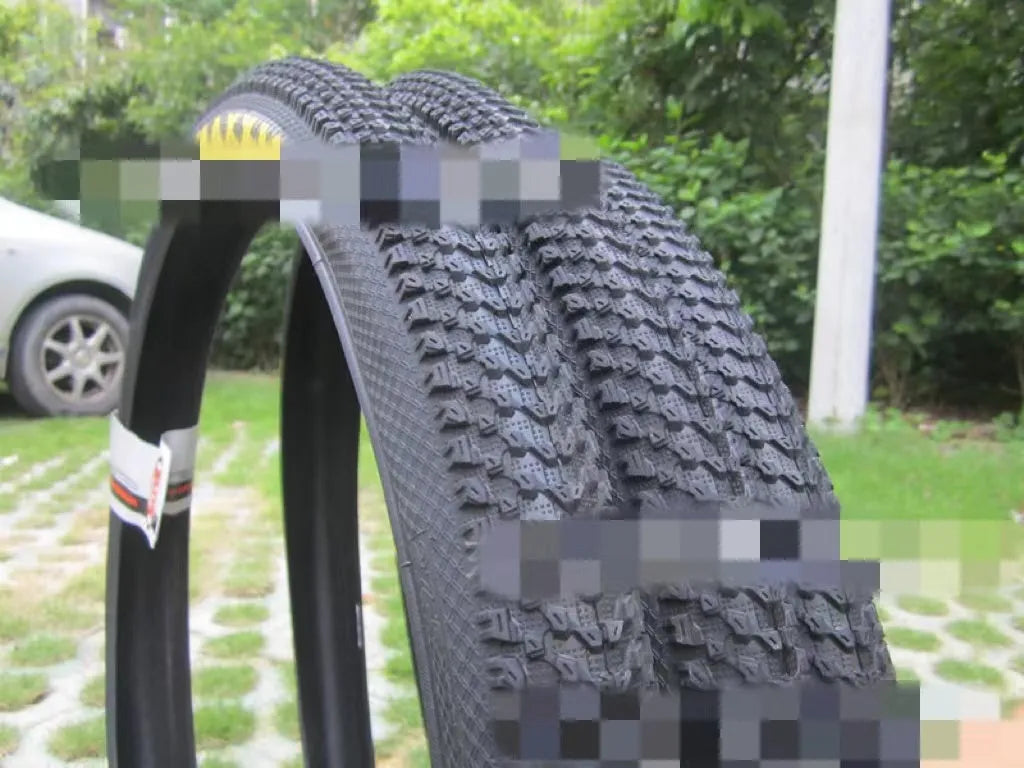 Ultralight puncture-resistant mountain bike tyre showing tread pattern and available sizes