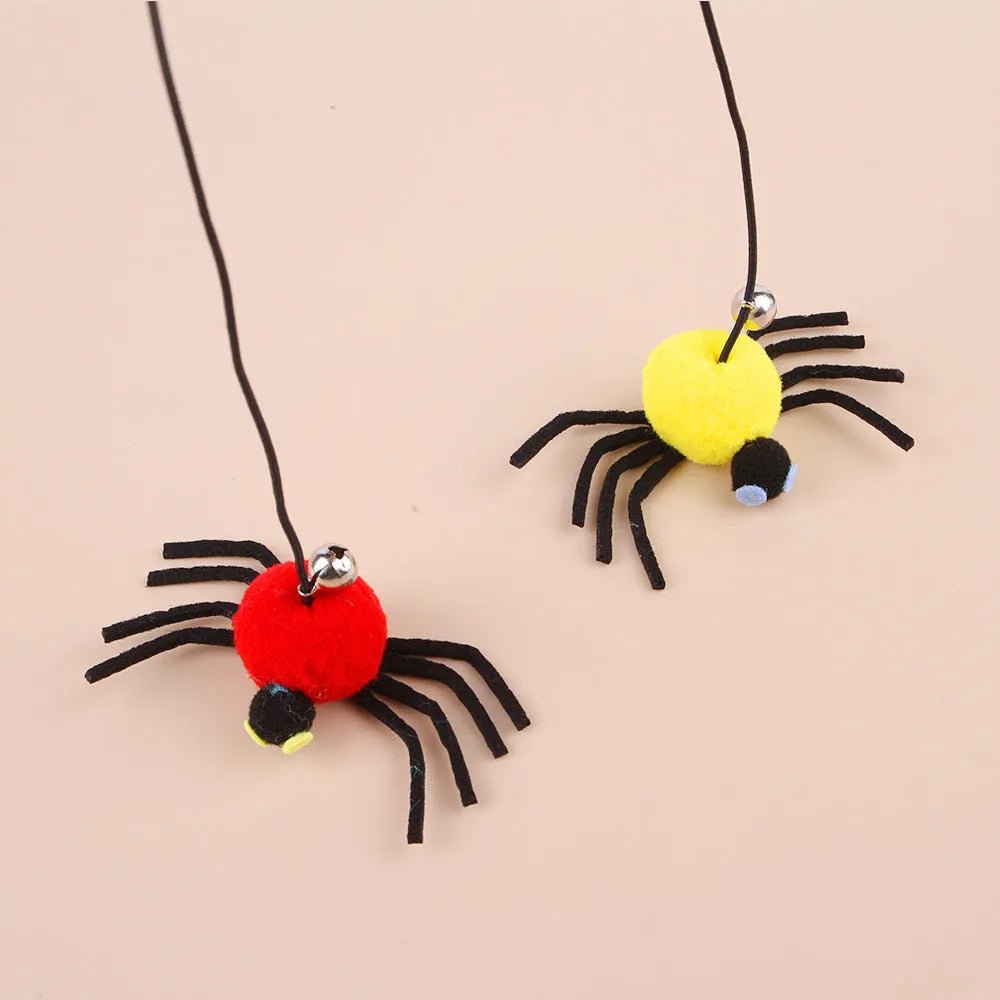 Hanging door cat toy with elastic rope, feather, bell, and spider attachment in red colour