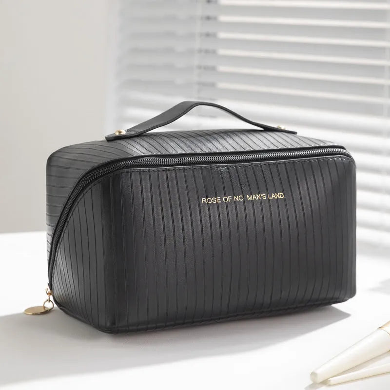 Beige cubic PU vertical pattern pillow makeup bag for travel, showing dimensions of 22.5cm by 12.5cm.