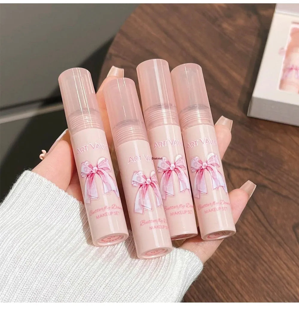 Butterfly Box makeup set with four pink matte lip muds, powder blusher, and matching necklace