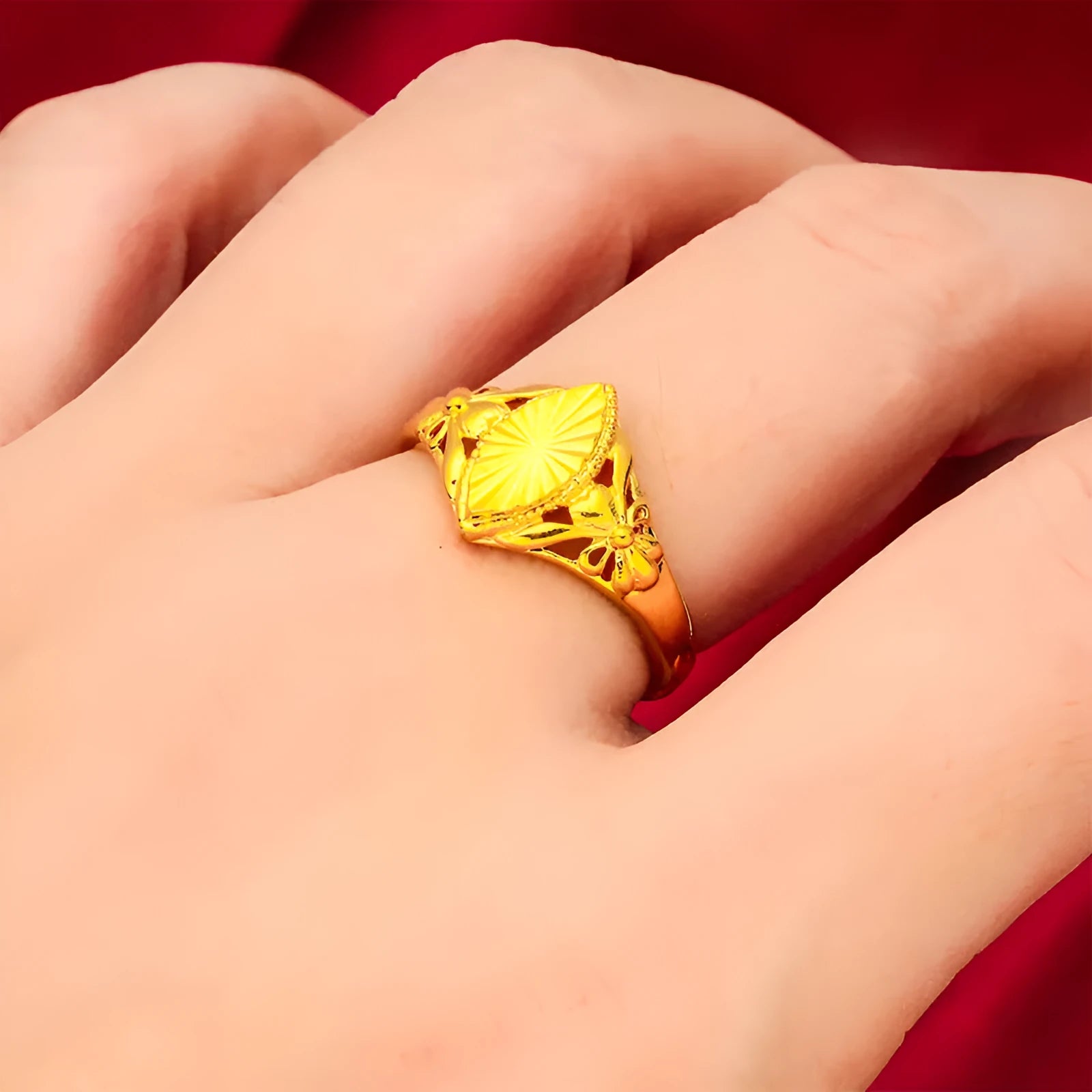 Gold geometric flower ring with open diamond design and textured surface on brass base