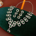 Diamond sunflower earrings and necklace set in silver finish on display