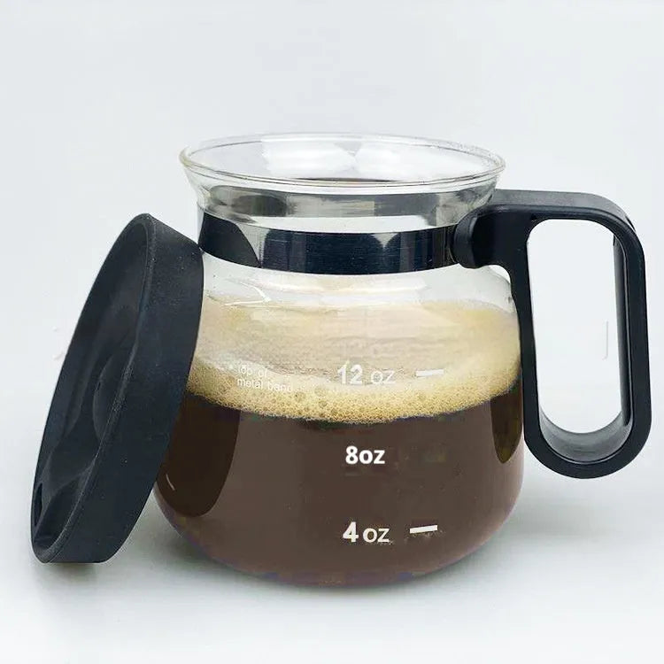 Transparent borosilicate glass stovetop coffee maker with a black silicone cover