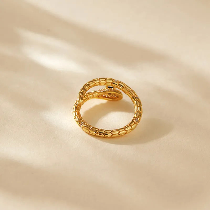 Adjustable copper snake ring with gold colour finish and diamond surface treatment