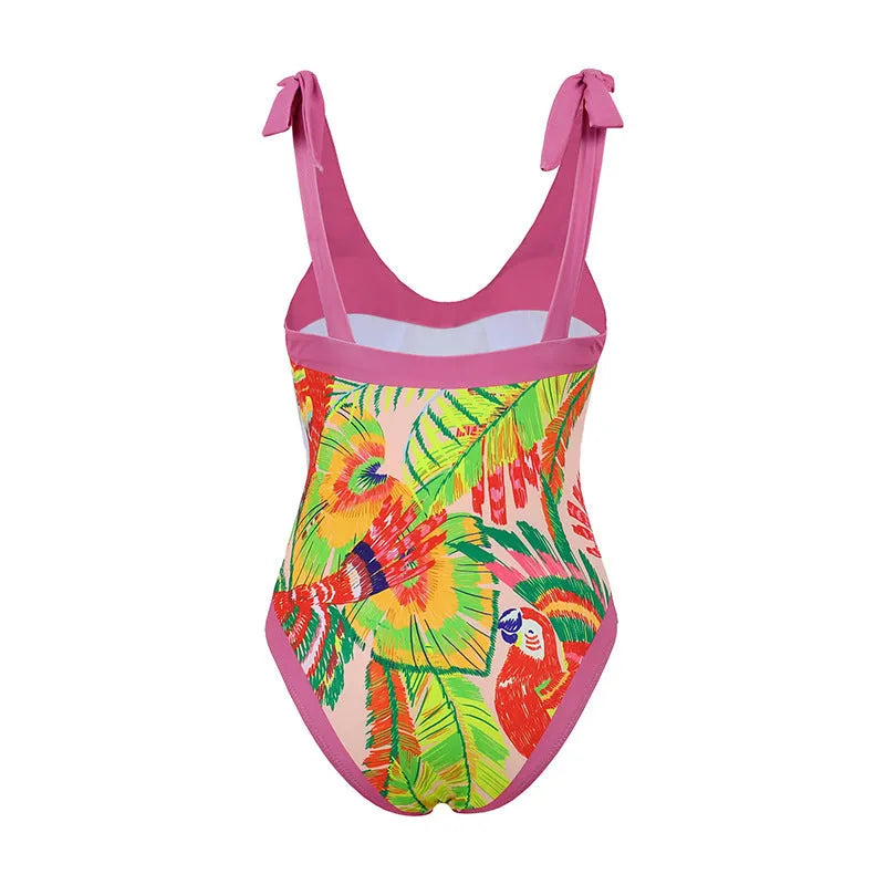 Women's pink floral print one-piece swimsuit with v-neck, covered belly, and attached thin skirt.