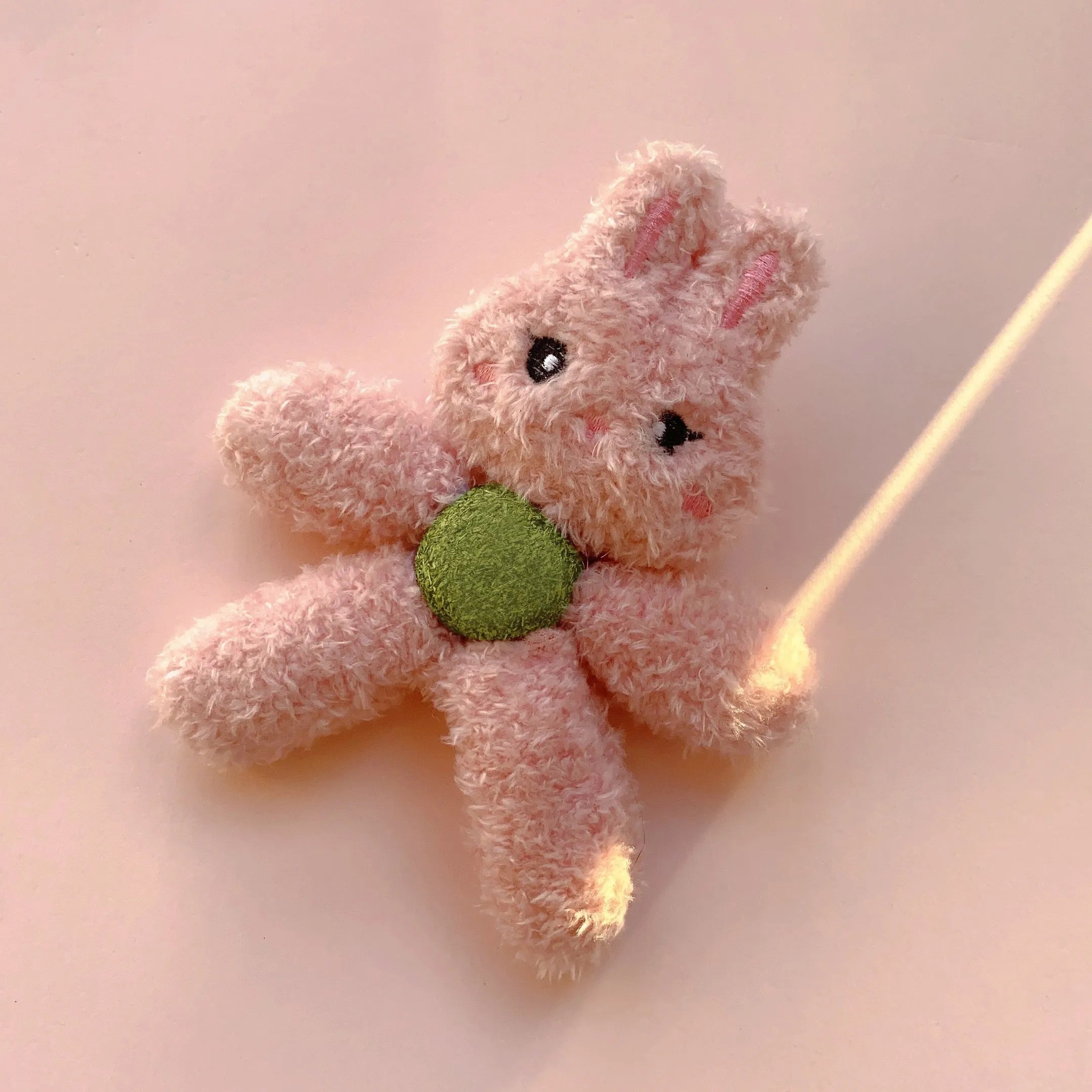 Edible catnip chewing ball in plush animal design with cat grass filling for dental cleaning