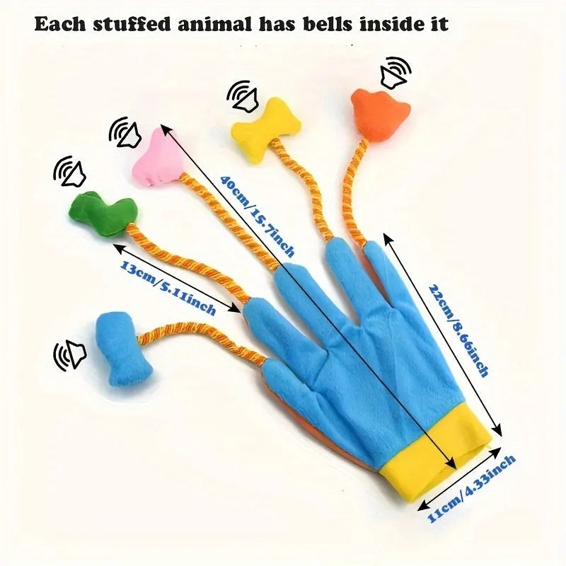 Yellow and blue plush cat toy with a bell and magic glove handle on a plain background.