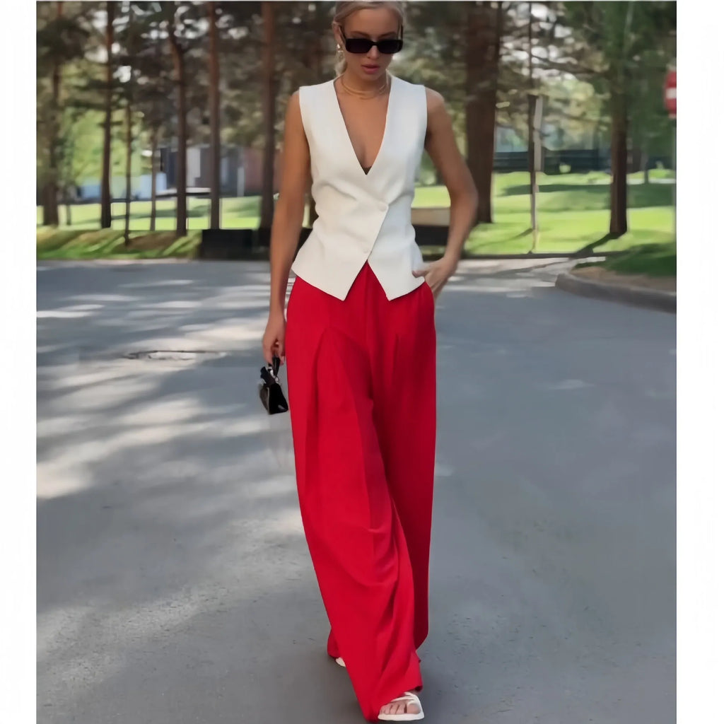 Women's beige polyester two-piece set showing sleeveless V-neck top with high-waist wide-leg trousers