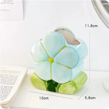 Ceramic flower pen holder storage box with floral patterns in blue, pink and purple colour variations