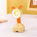 Cartoon animal magnetic night lamp with adjustable head on metallic surface