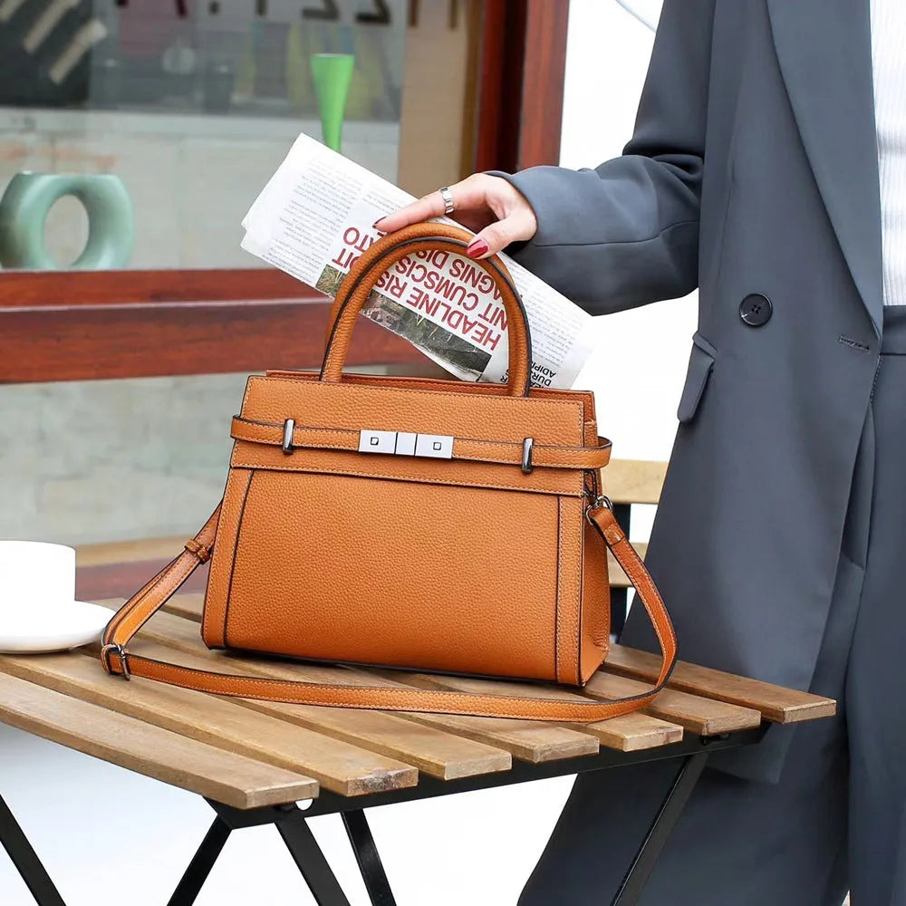 Genuine leather small square shoulder bag in almond green colour showing internal compartments