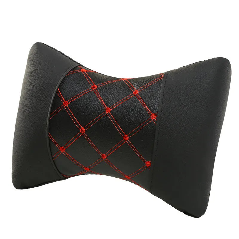 Black leather quilted car headrest neck pillow with diamond pattern and contrast stitching.