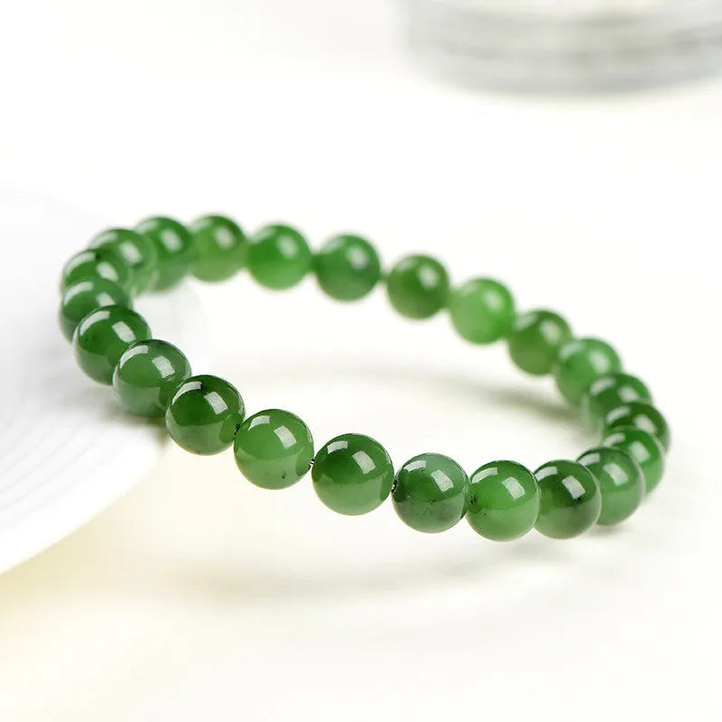 Natural Hetian jade jasper bead bracelet with polished finish in earthy green tones