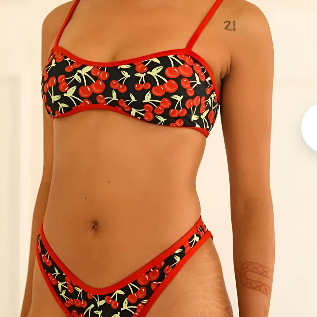 Women's cherry print floral polyester bikini swimsuit set with tube top and briefs.