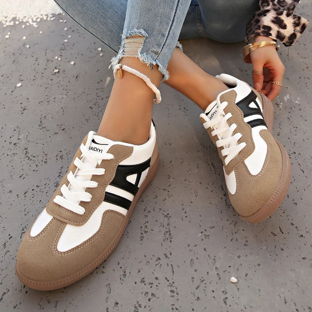 Women's retro colour matching lace-up trainers in black, grey or khaki with low heel platform and cross strap details