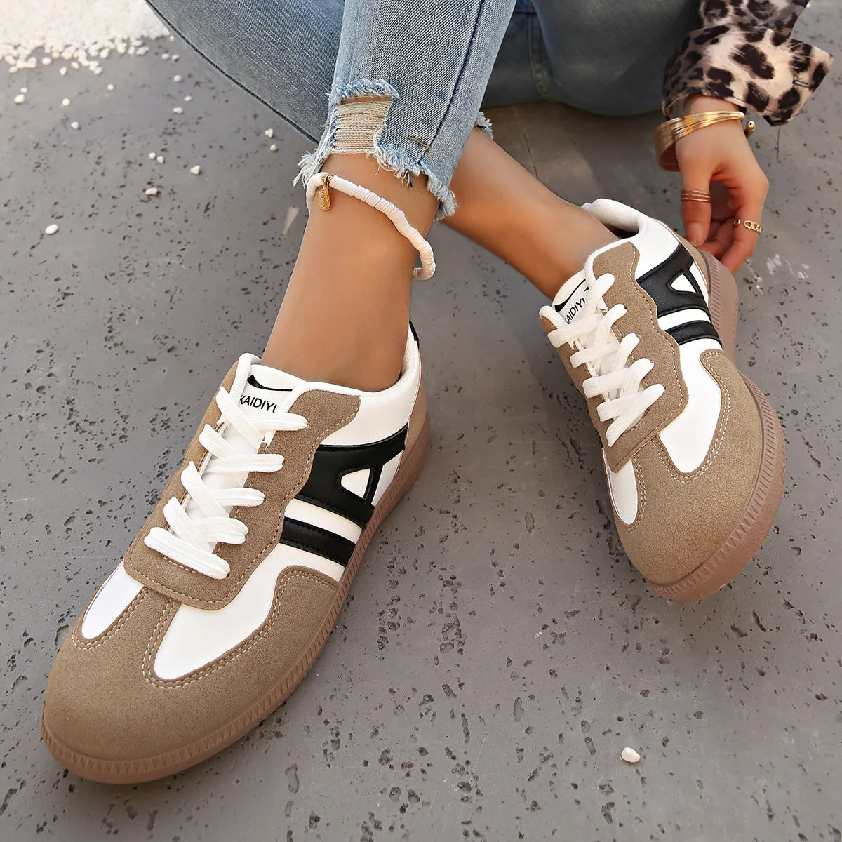 Women's retro colour matching lace-up trainers in black, grey or khaki with low heel platform and cross strap details