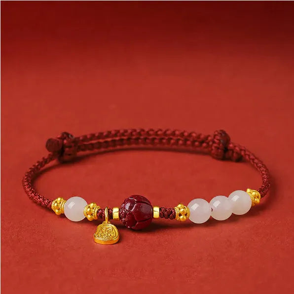 Women's adjustable 925 silver bracelet with Hetian jade and cinnabar red rope design on wrist