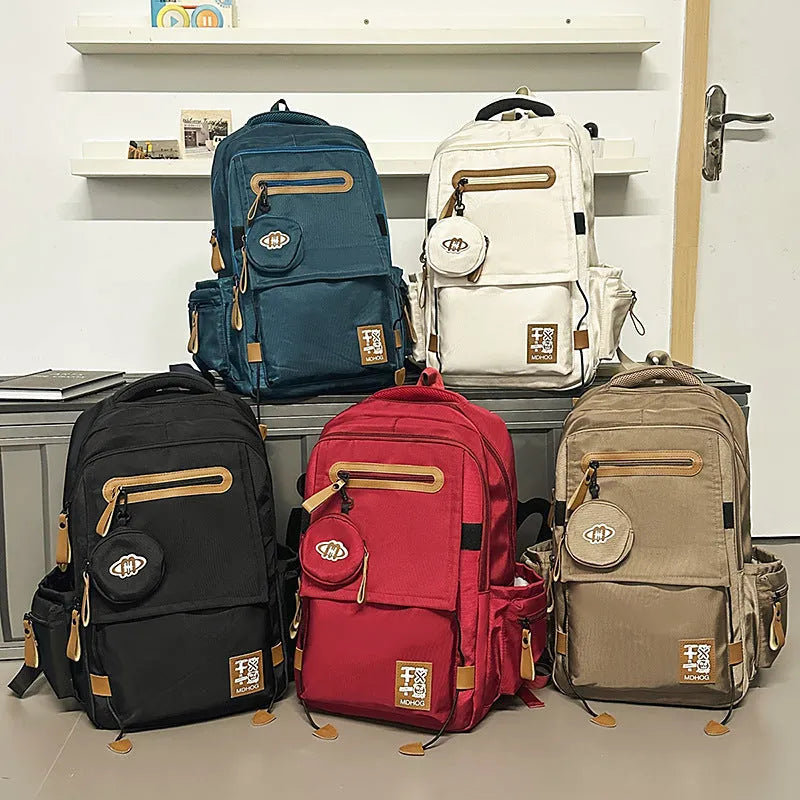 Japanese large capacity leisure travel backpack in khaki with contrast stitching and nylon waterproof finish