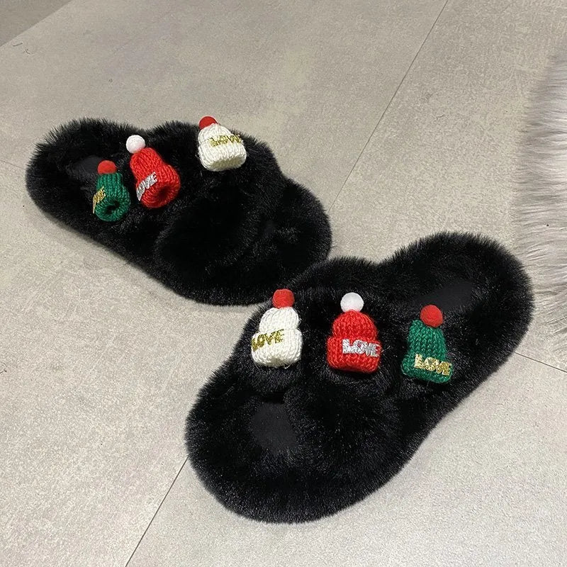 Women's Christmas slippers with a red hat decoration on a faux plush upper, shown in black.