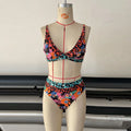 Women's floral print high-waist bikini set for swimming in polyester fabric.
