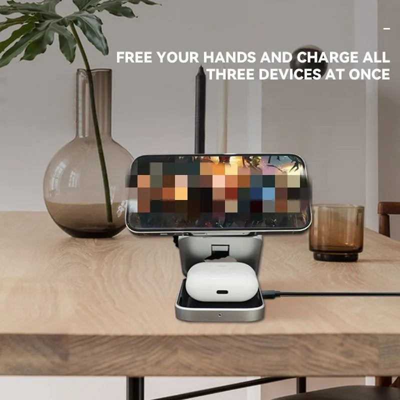 Folding three-in-one desktop wireless charging bracket for Apple, Samsung, and Google Pixel devices on a table.