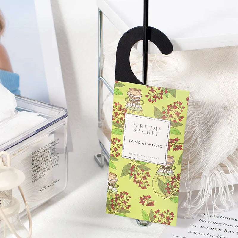 Five 30g lavender and rose scented wardrobe sachets on a shelf, each measuring 21x8cm
