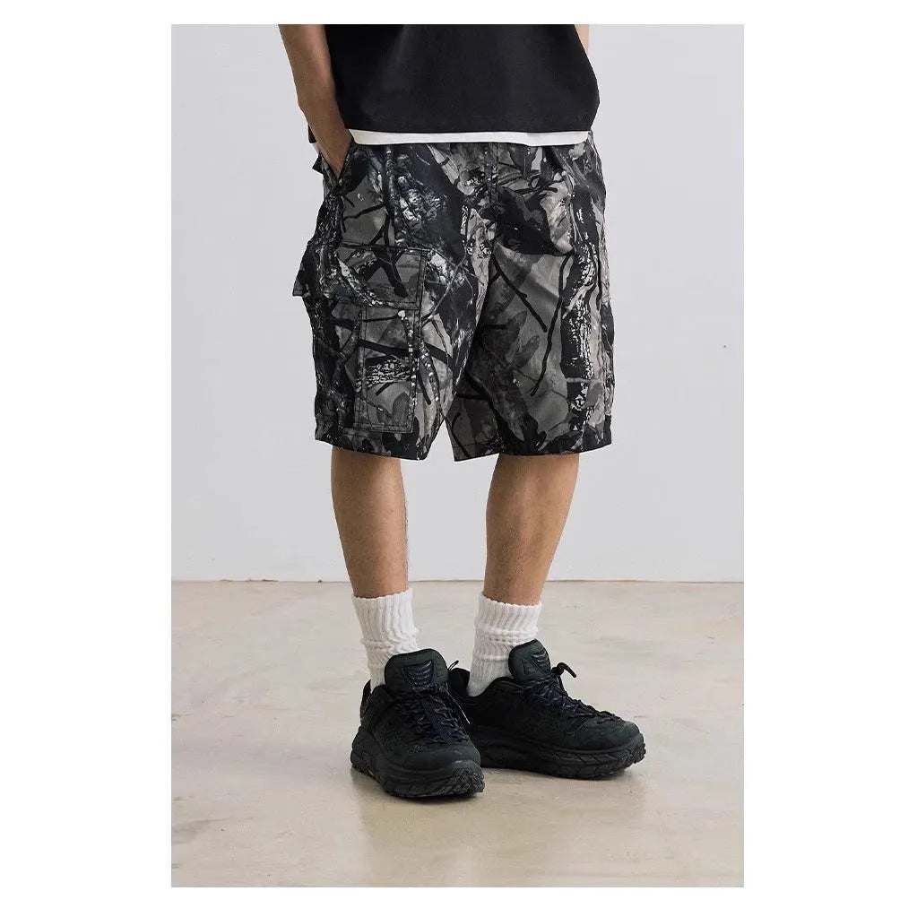 Straight-leg denim shorts in black and army green colours showing loose casual fit and mid waist design