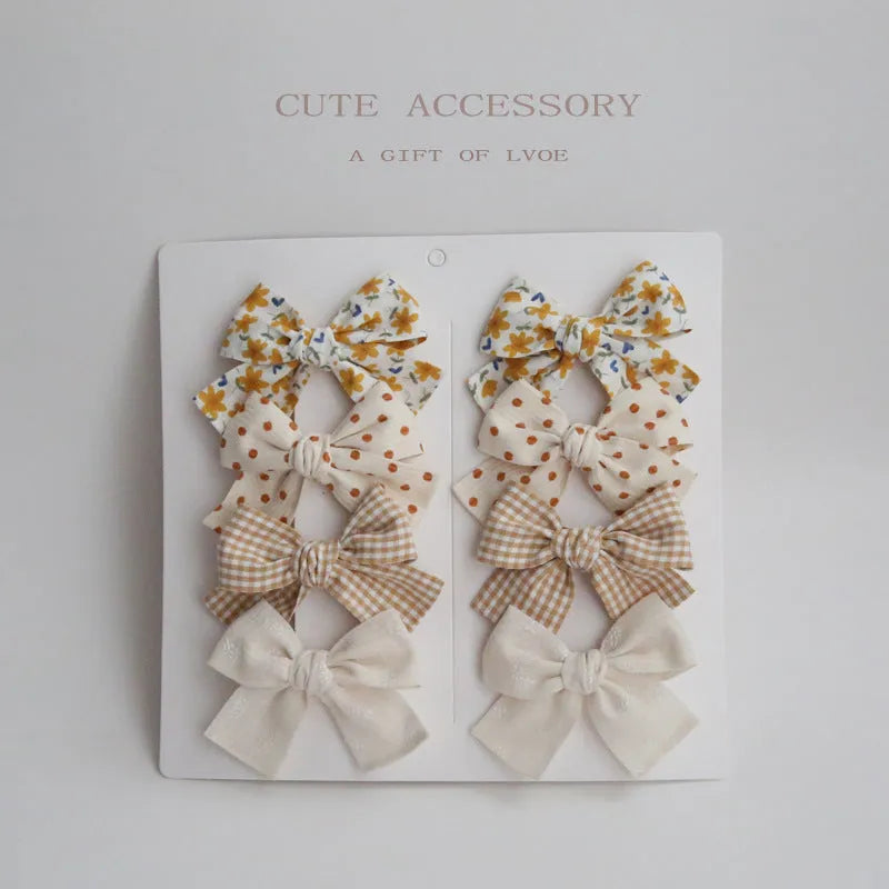 Children's cloth hairclips with dovetail bow decoration in multiple colour options