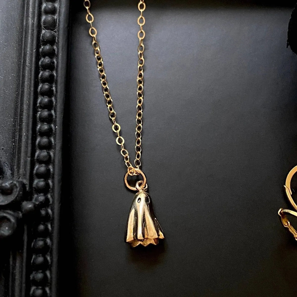 Ghost pendant necklace with titanium steel pendant on a twisted stainless steel chain.