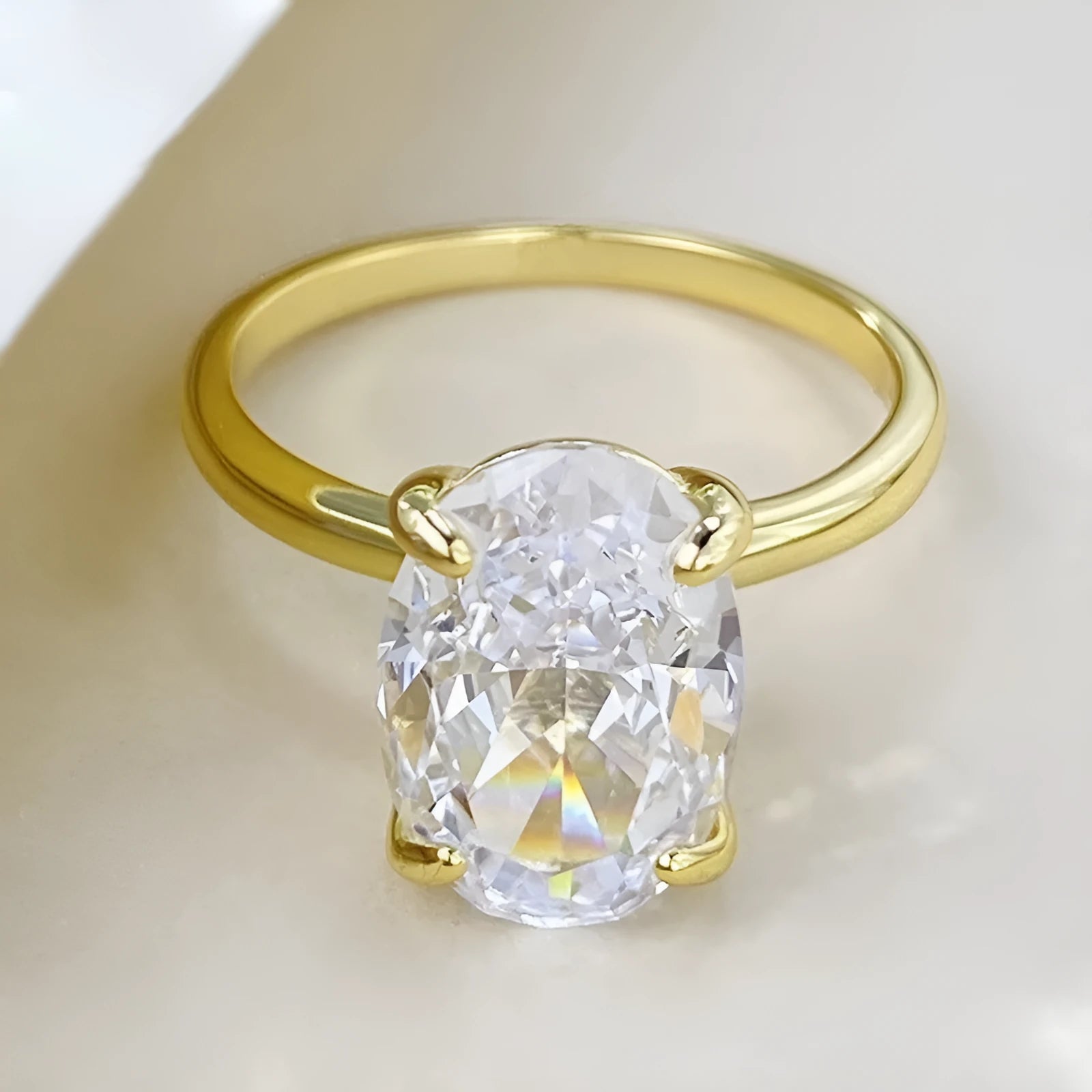 Oval gemstone ring for women with four-claw setting in gold or silver plating