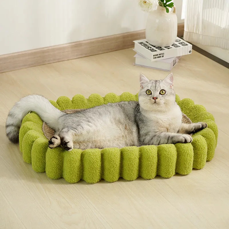 Green oval cat scratcher bed made from sisal, showing its bowl shape and textured scratching surface.