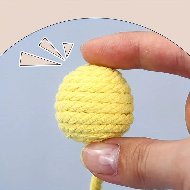 Colourful cat toy ball with rope and built-in bell available in green pink purple yellow for kittens