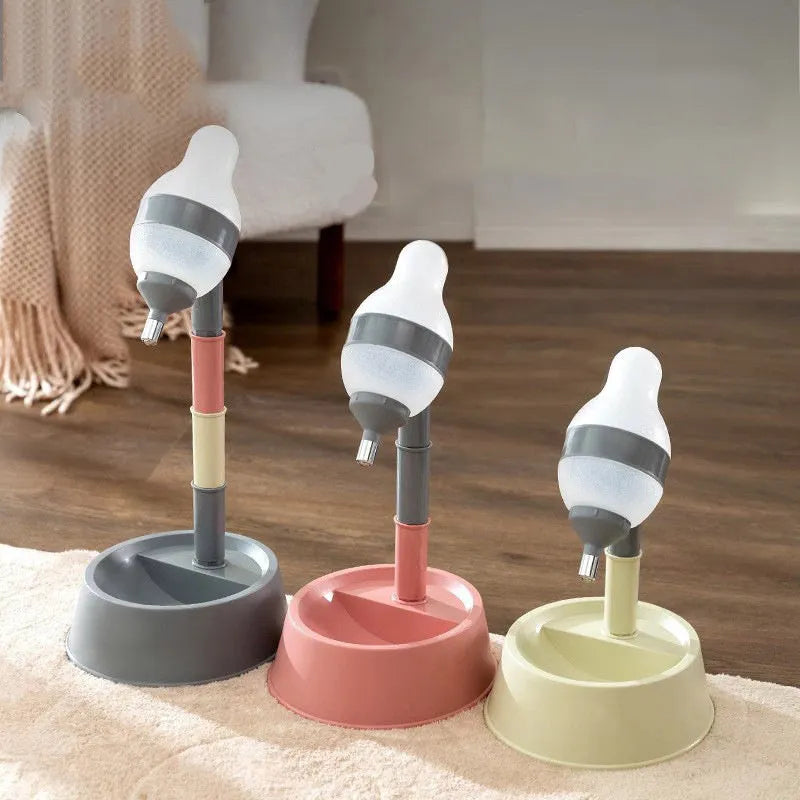 Green adjustable pet water dispenser showing height adjustment bars and ball-tip drinking nozzle